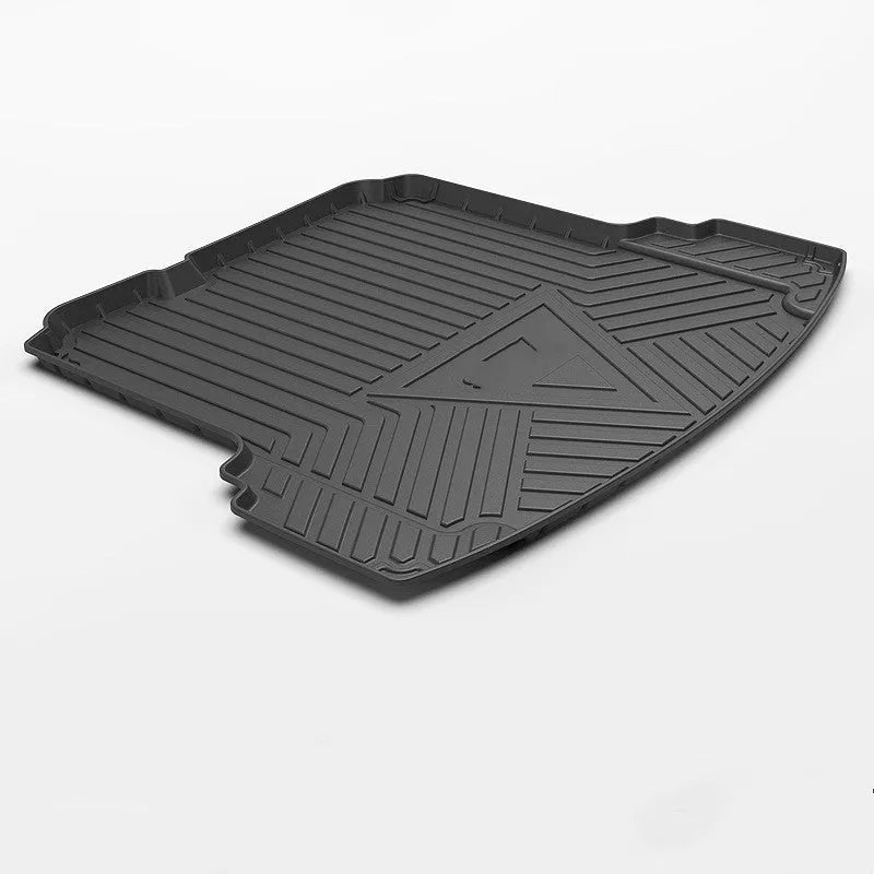 Black carbon fibre pattern tailored car boot liner mat fitted in an estate vehicle