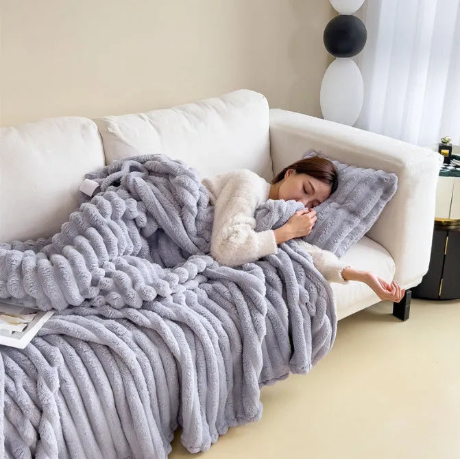 Double-sided bubble velvet faux rabbit fur blanket in a solid colour, shown folded.