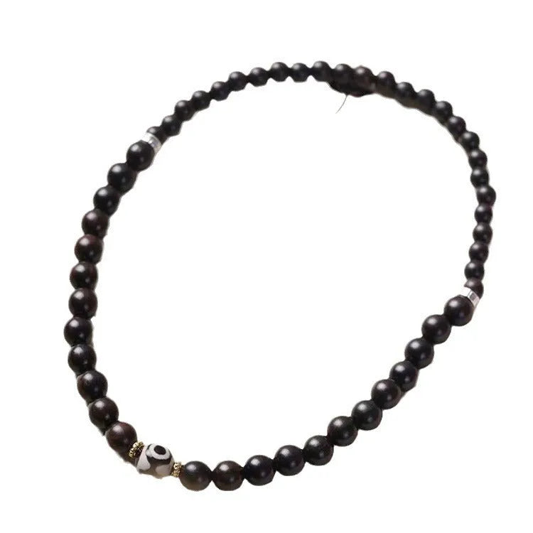 Tibet beads ebony bracelet showing two wooden circles on dark wood with 8mm diameter