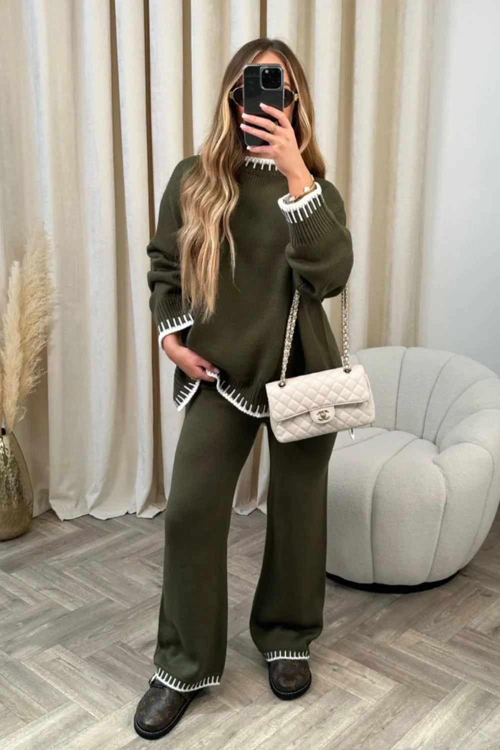 Stylish women's two-piece suit set with long-sleeved top and loose pants in various colours