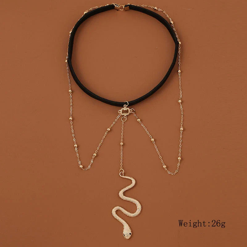 Fashionable gold beaded leg chain with snake pendant for women, featuring a captivating design and adjustable fit for comfortable wear.