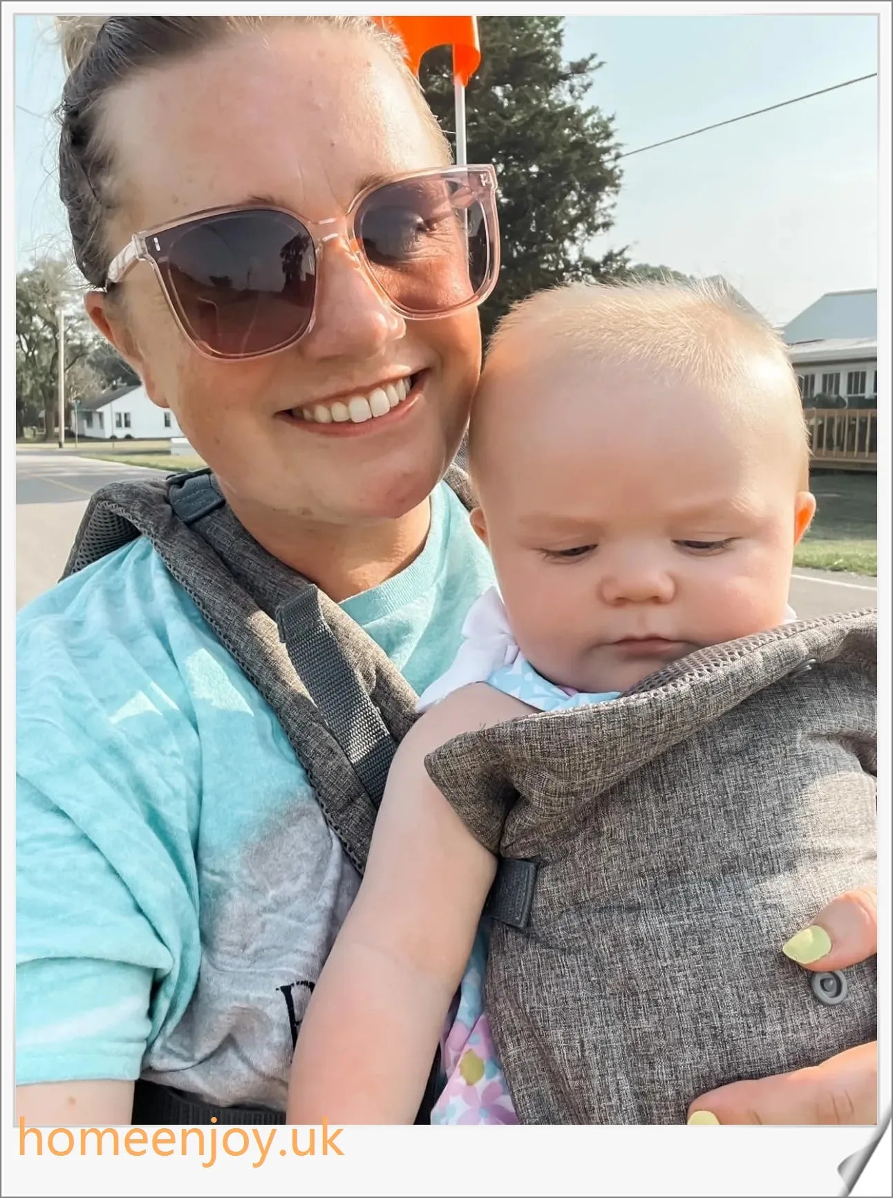 Ergonomic baby carrier made with soft, breathable cotton for comfortable, secure babywearing