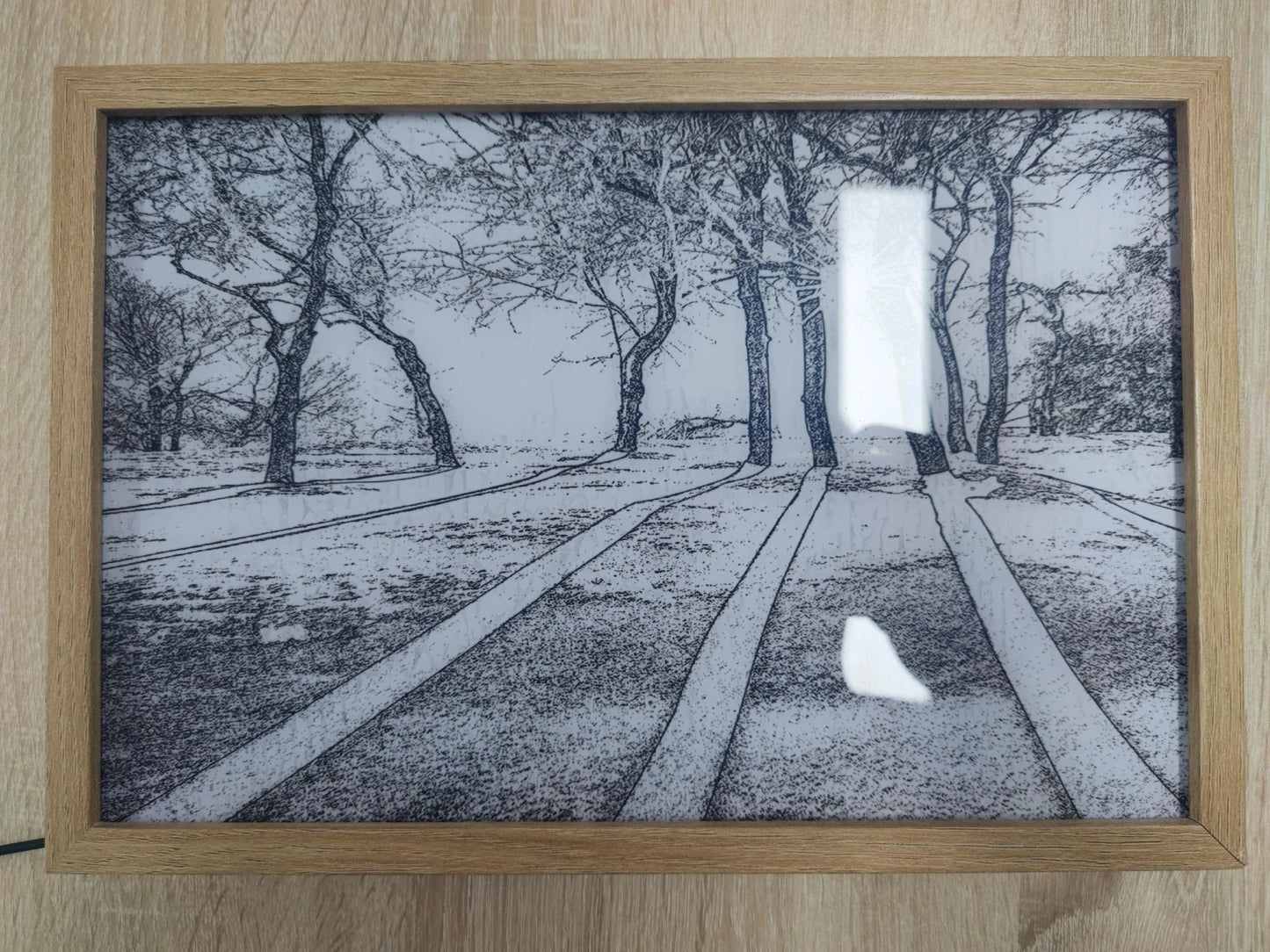 Illuminated picture frame with LED lights creating a mesmerizing display of art and ambiance