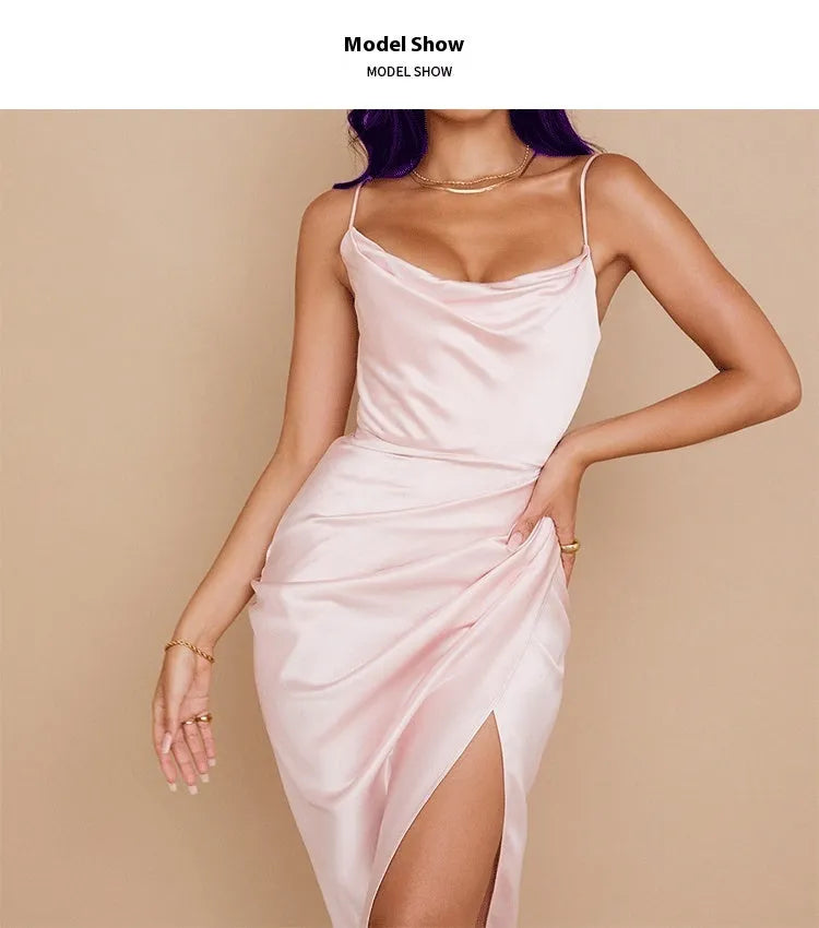 A high-waisted satin midi skirt with a side slit, shown in a solid colour.