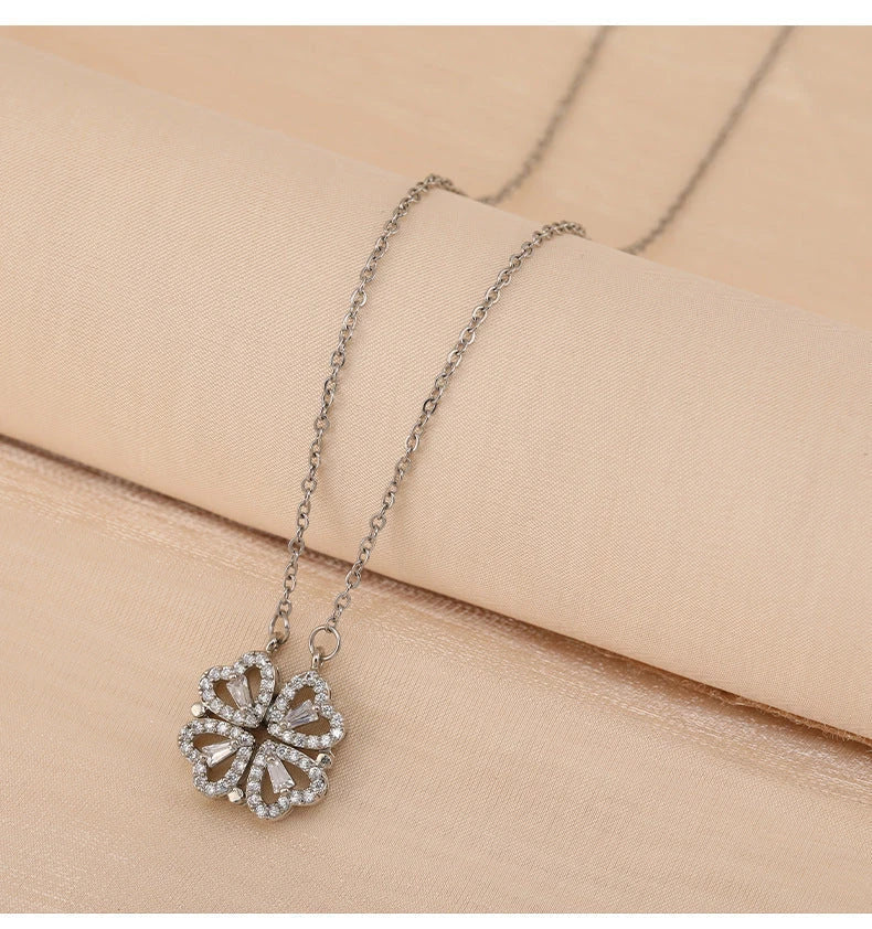 Elegant four-leaf clover pendant necklace made of premium titanium steel with a captivating diamond inlay design