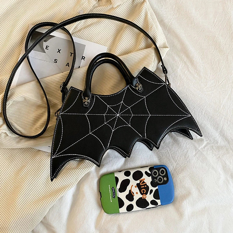 A stylish Halloween shoulder bag with a captivating spider web design, made of durable PU leather and offering ample storage space.