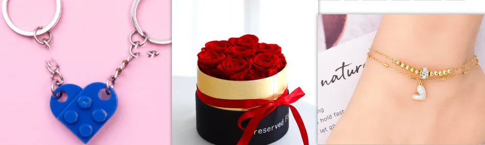 Luxury gift box containing an arrangement of preserved red eternal roses on a dark background.
