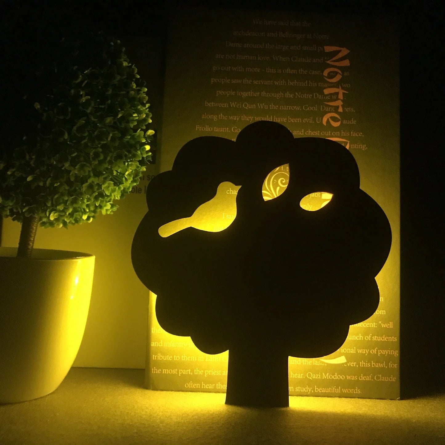 A stylish cat-themed LED lamp that automatically lights up when it detects sound, creating a cozy, ambient glow in a room.