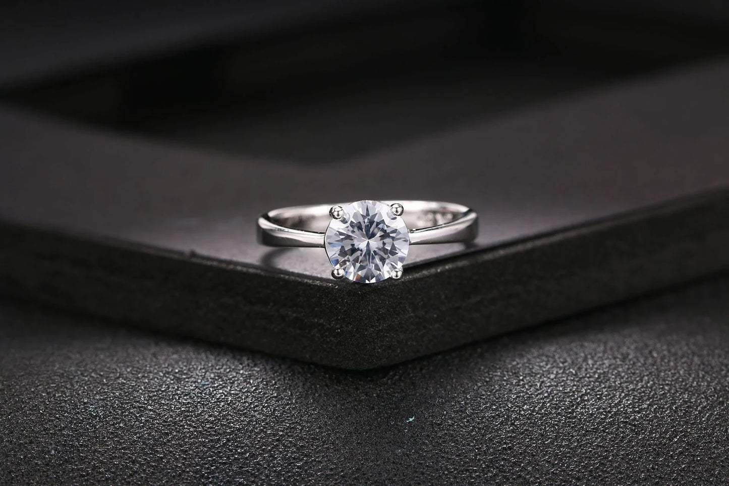 Close-up of a beautiful rose gold ring with sparkling zircon stones