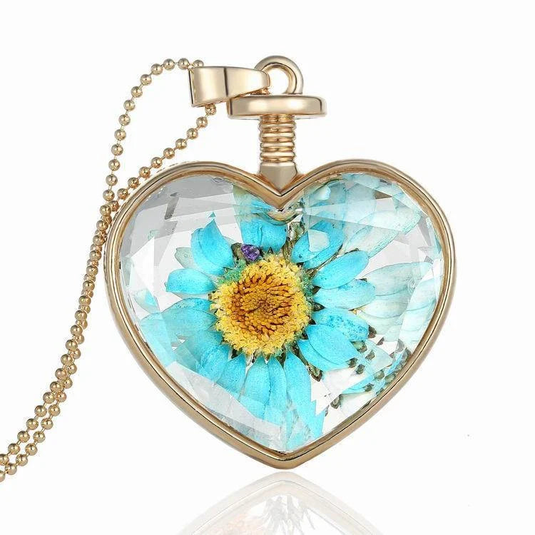 Elegant floral pendant necklace with a dried flower charm on a gold-tone chain
