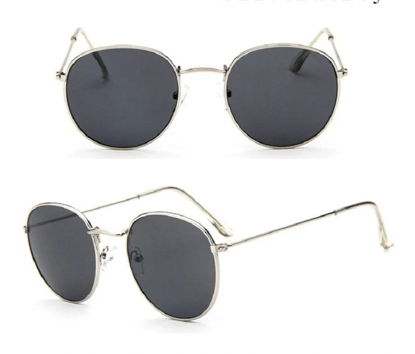 Stylish retro sunglasses for women with metal frame and glass lenses