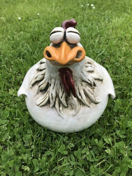 Resin chicken garden ornament with vibrant colours and charming design, adding whimsical appeal to outdoor British garden display