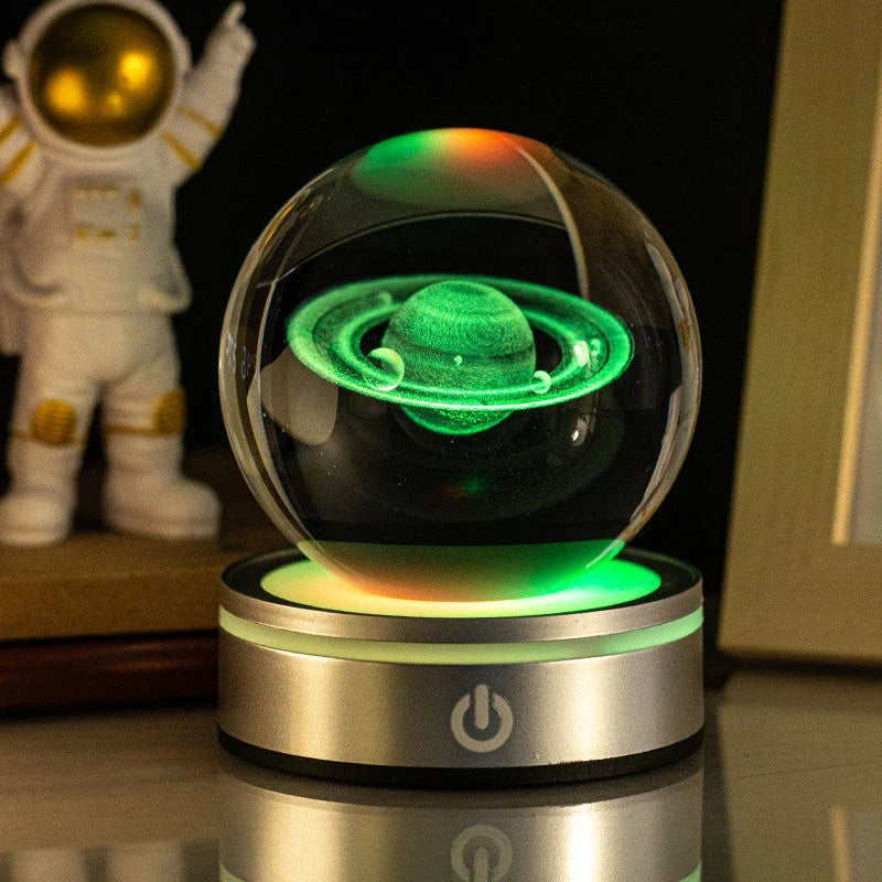 Luminous crystal ball with various celestial-inspired designs, including the Milky Way, Solar System, and Constellation.