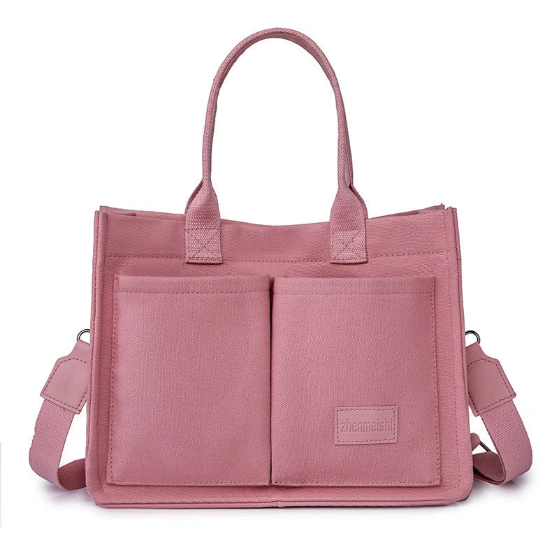 Premium canvas tote bag with multiple pockets, adjustable shoulder strap, and stylish design for everyday use