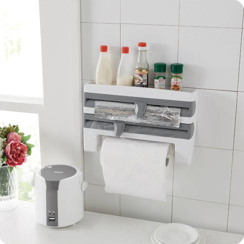Multifunctional kitchen wall organizer with cling wrap, foil, and paper towel storage compartments and built-in cutting tools