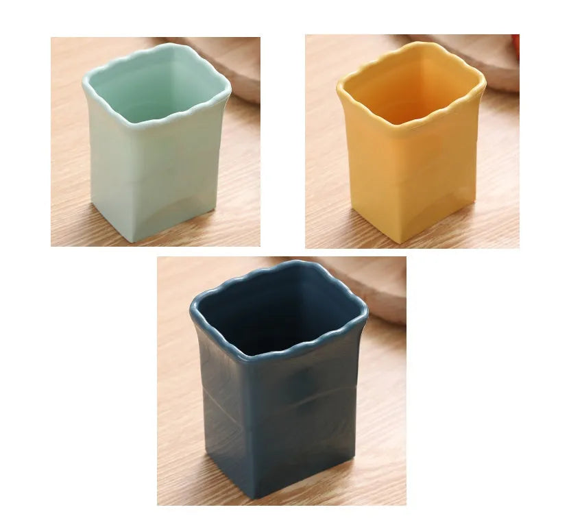 Green stainless steel cup-shaped kitchen slicer for cutting fruits and eggs on a countertop.
