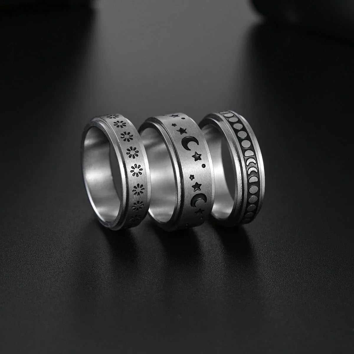 Titanium steel ring with intricate star and moon designs, available in various sizes and colors