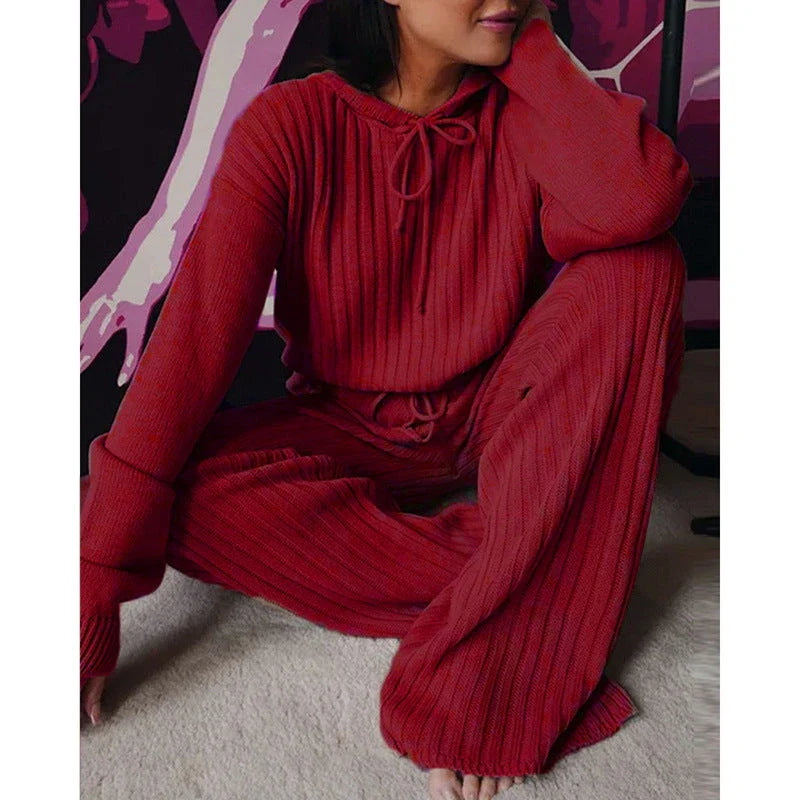 A stylish two-piece casual set featuring a hooded top with long sleeves and matching bottoms in a variety of vibrant colors.