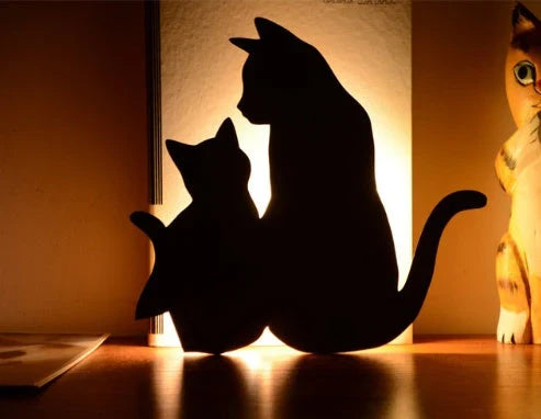 Charming pet-inspired mood lamp with various animal-shaped designs, including walking cat, mother and child cat, licking cat, and Pikachu