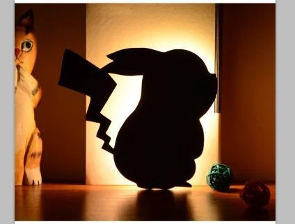 A stylish cat-themed LED lamp that automatically lights up when it detects sound, creating a cozy, ambient glow in a room.