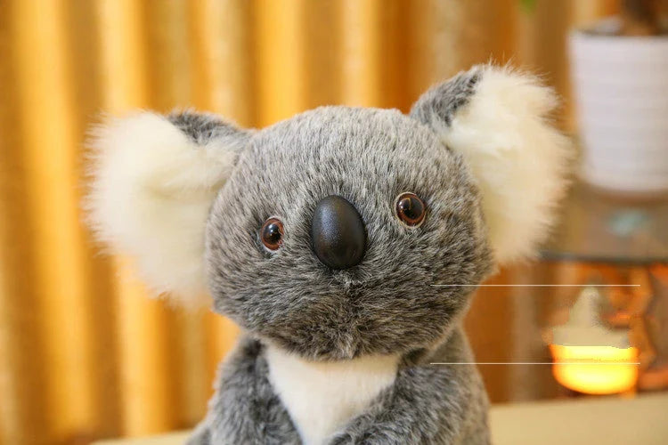 A soft, cuddly koala plush toy with short, premium plush fur and 100% pure cotton filling, showcasing the high-quality British craftsmanship.