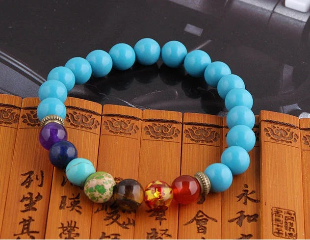 Handcrafted beaded bracelet with seven chakra-representing beads, designed to promote balance and well-being.