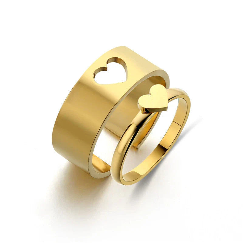 Elegant titanium steel rings in various designs including hearts, butterflies, and crosses, for a timeless and versatile accessory