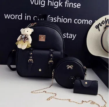 Women's black PU leather backpack, shoulder bag, and card bag set with flower designs.