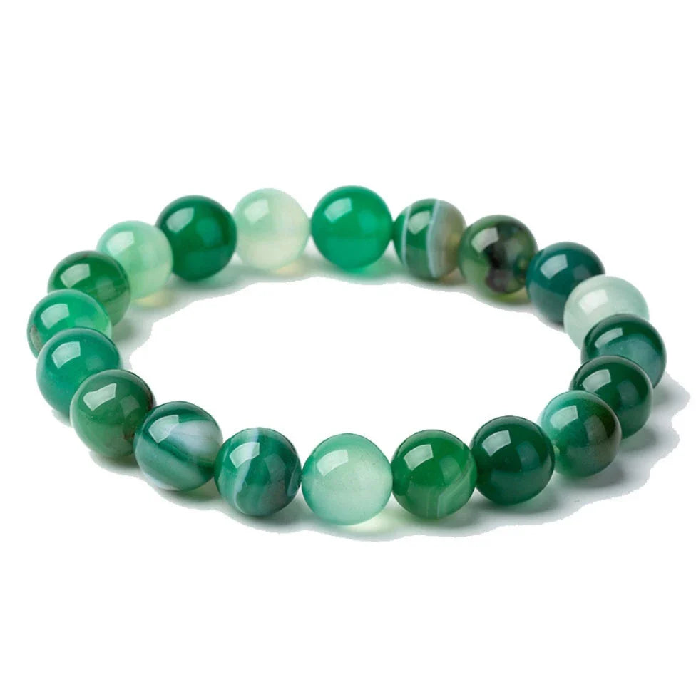 Handcrafted beaded bracelet with seven chakra-representing beads, designed to promote balance and well-being.