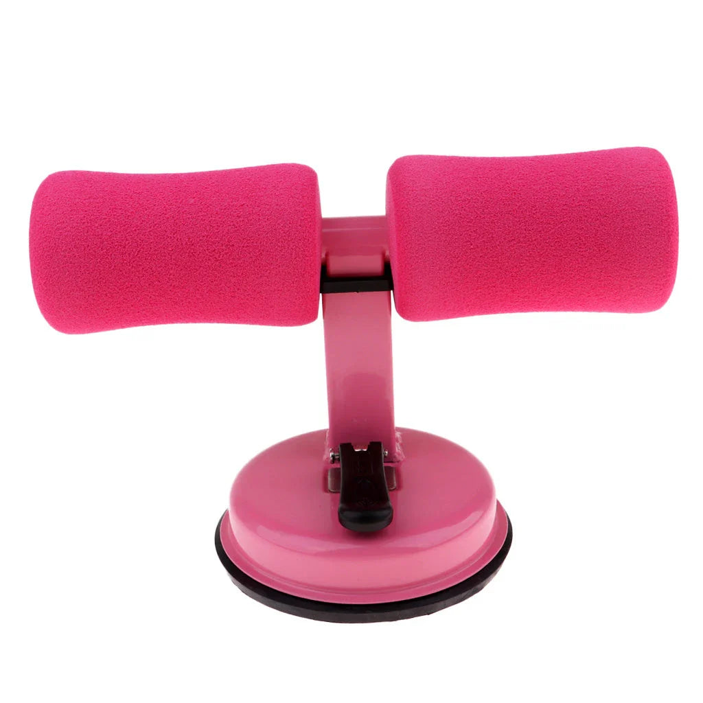 Compact sit-up strength trainer with steel springs and foam padding for home fitness