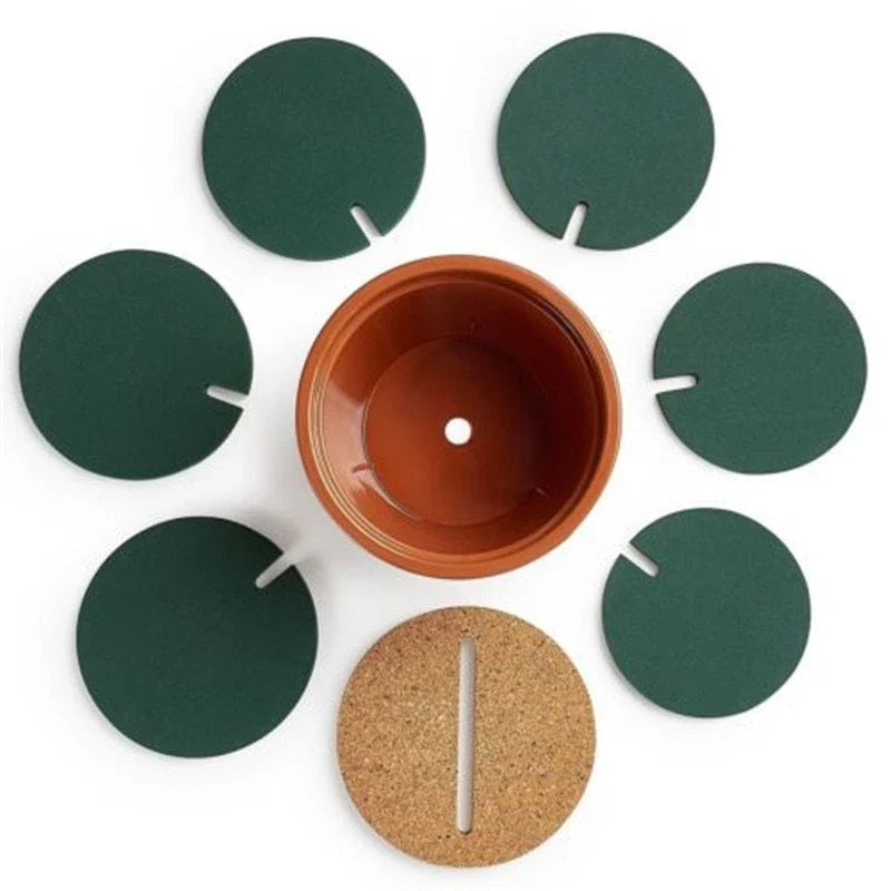 Stylish cactus-shaped coasters in a flowerpot-style holder, protecting a table from hot or cold drinks