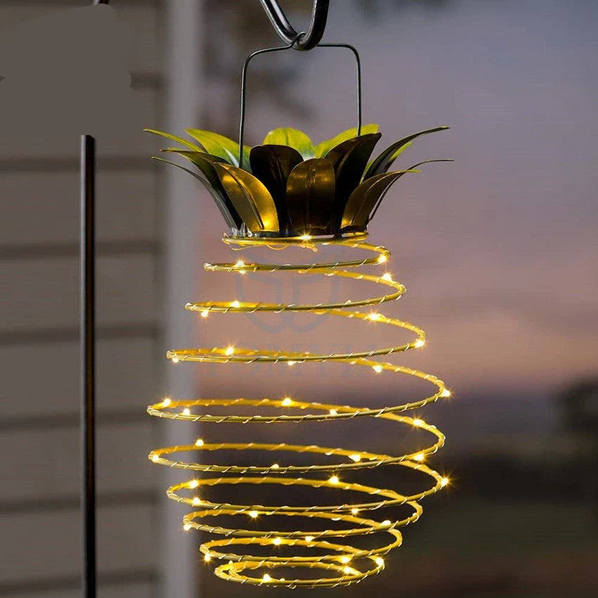 Solar-powered pineapple-shaped outdoor lights with a weather-resistant metal frame and warm white LED bulbs