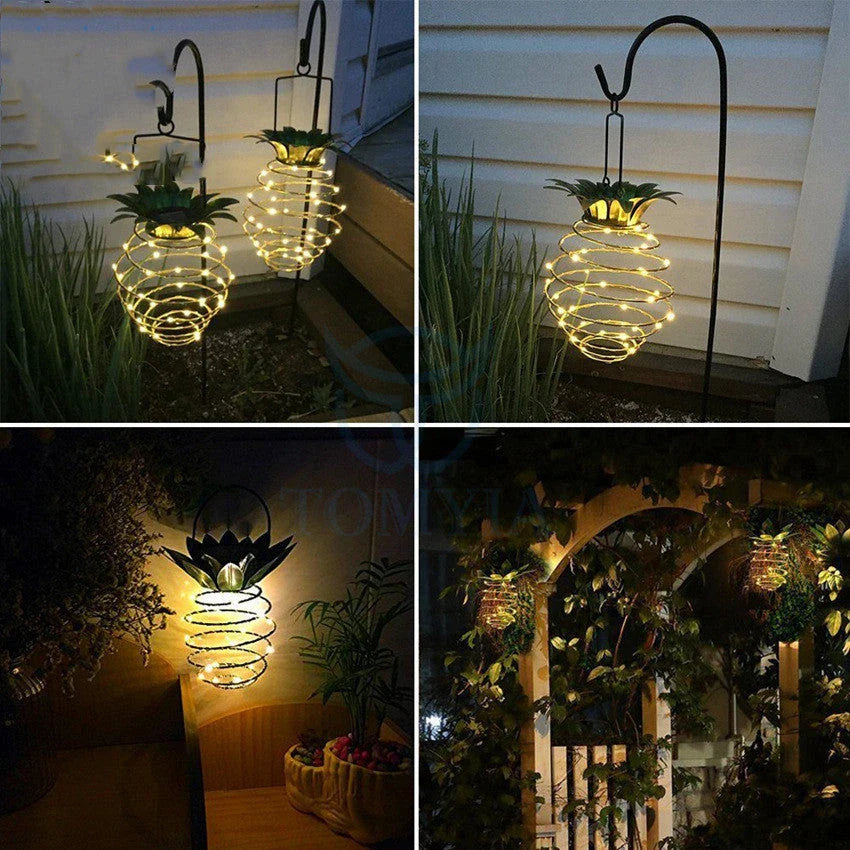 Solar-powered pineapple-shaped outdoor lights with a weather-resistant metal frame and warm white LED bulbs