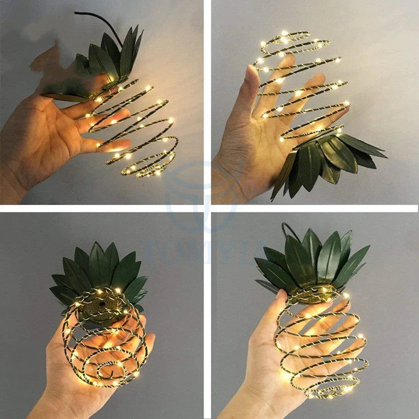 Solar-powered pineapple-shaped outdoor lights with a weather-resistant metal frame and warm white LED bulbs