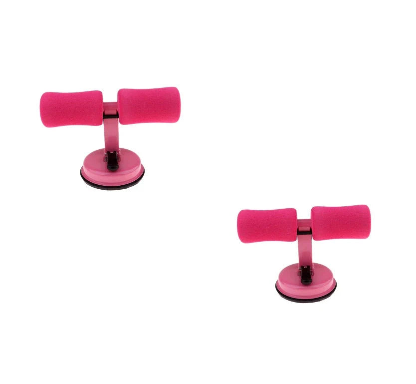 Compact sit-up strength trainer with steel springs and foam padding for home fitness