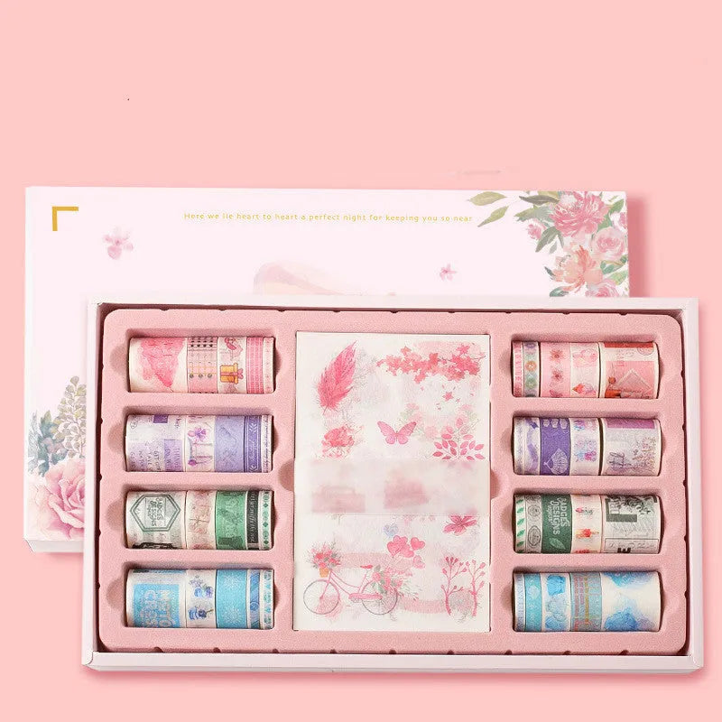 Box of 100 antique character decorative paper tape rolls in assorted colours and widths for accounting and crafts.