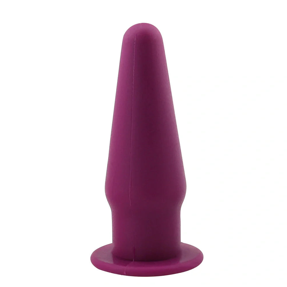 Premium silicone vibrating anal plug for G-spot stimulation in rose red, black, or purple.