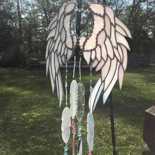 Stunning acrylic and metal angel wing chime suncatcher with sparkling crystal and glass accents, designed to bring a sense of peace and enchantment to your home or garden