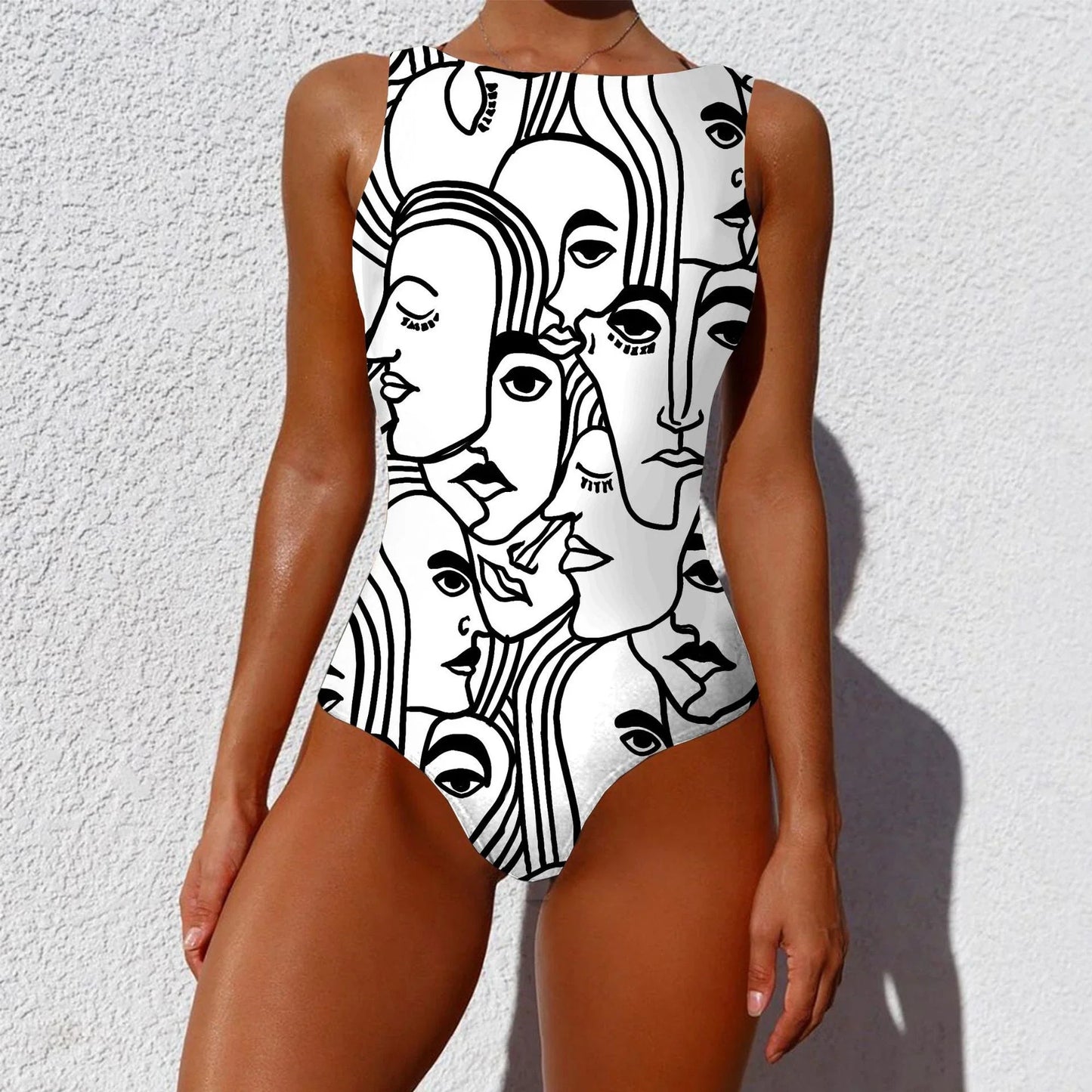 Stylish one-piece swimsuit featuring a vintage-inspired abstract print design for a bold, fashionable look
