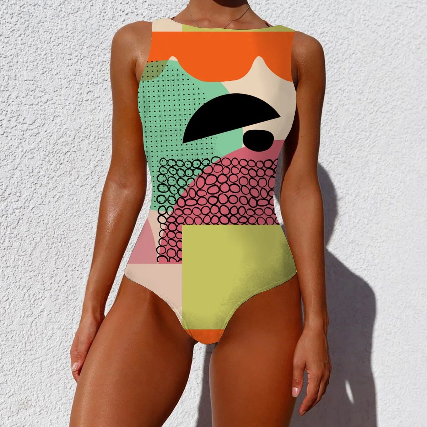 Stylish one-piece swimsuit featuring a vintage-inspired abstract print design for a bold, fashionable look