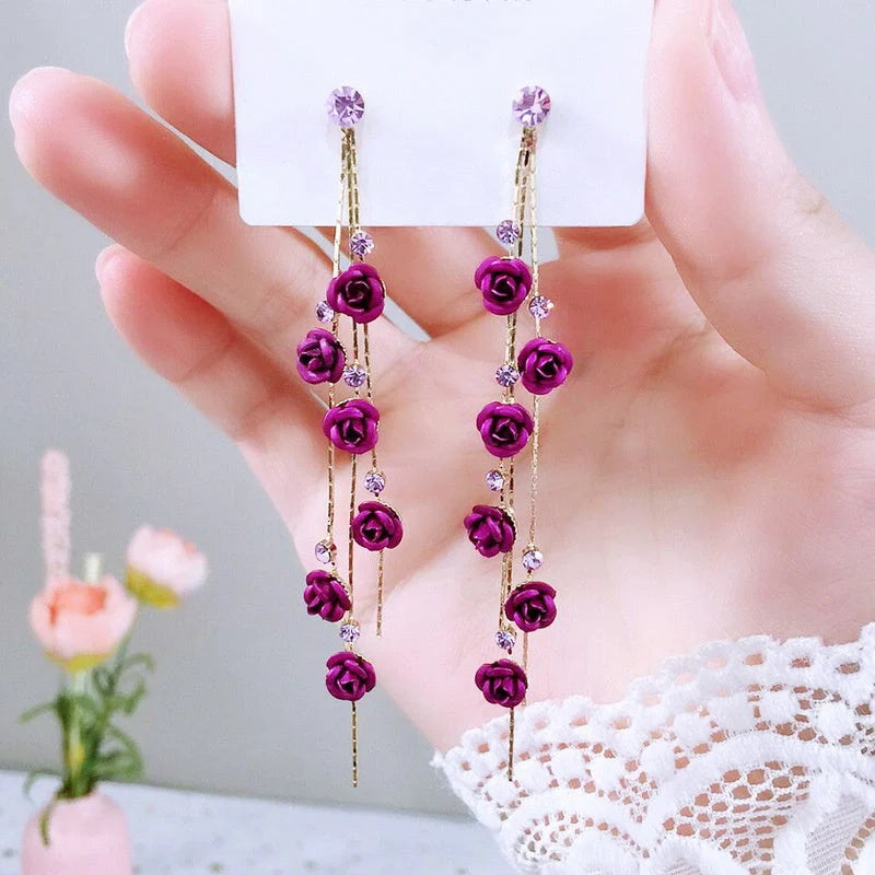 Elegant rose blossom earrings featuring delicate floral designs and tassel accents in a variety of styles