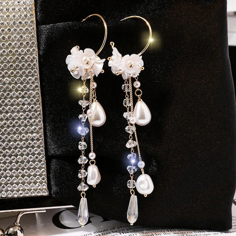 Elegant rose blossom earrings featuring delicate floral designs and tassel accents in a variety of styles