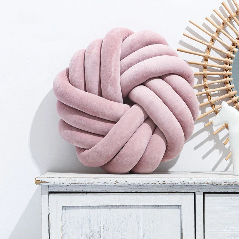 Plush decorative throw pillows with knotted ball design in various colors for living room, bedroom, and photography