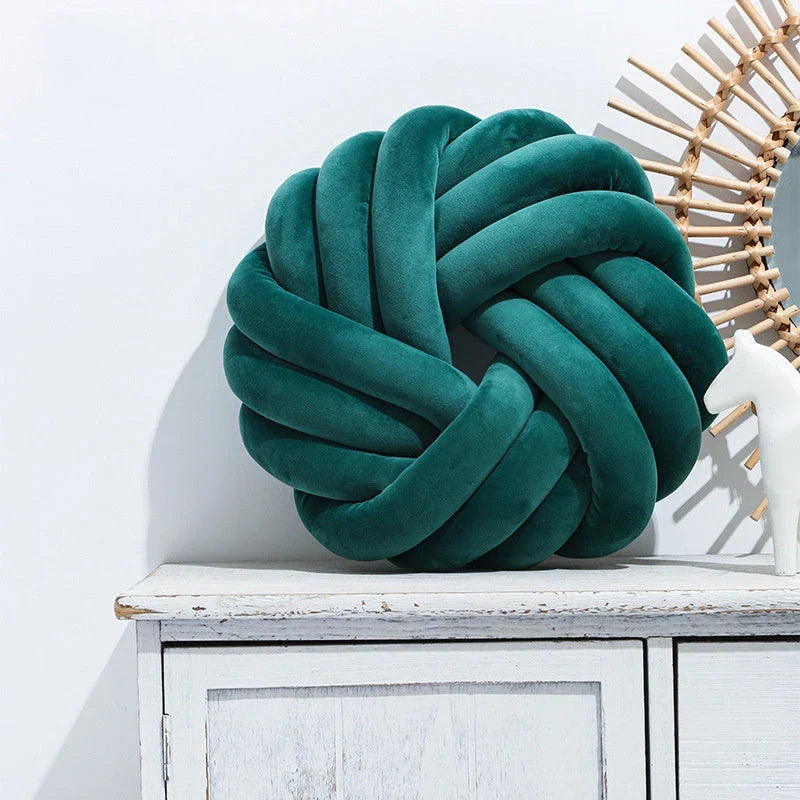 Plush decorative throw pillows with knotted ball design in various colors for living room, bedroom, and photography