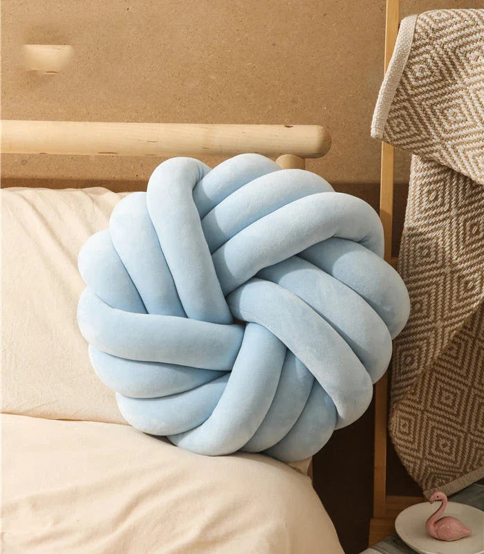 Plush decorative throw pillows with knotted ball design in various colors for living room, bedroom, and photography