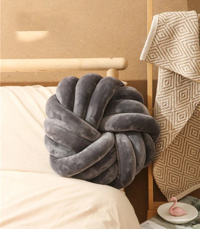 Plush decorative throw pillows with knotted ball design in various colors for living room, bedroom, and photography