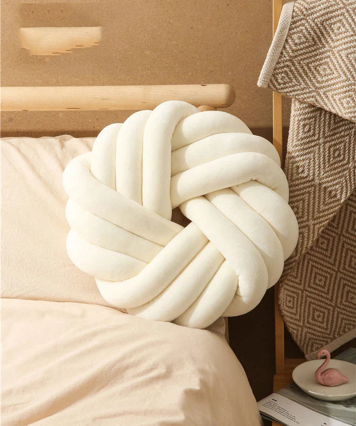 Plush decorative throw pillows with knotted ball design in various colors for living room, bedroom, and photography
