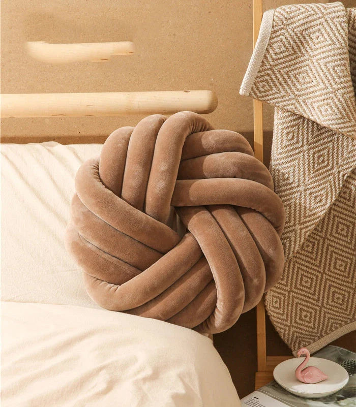 Plush decorative throw pillows with knotted ball design in various colors for living room, bedroom, and photography