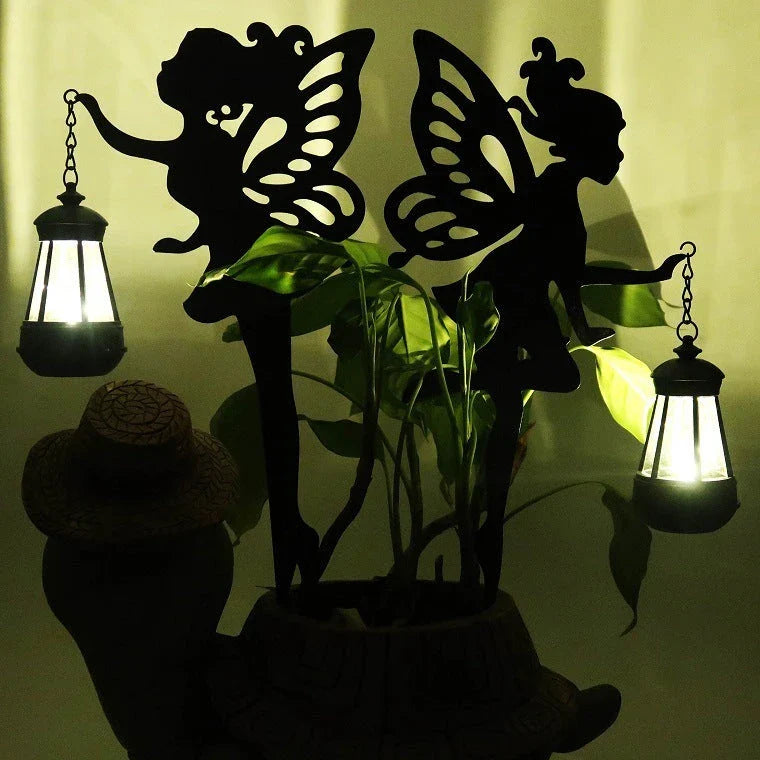 Solar-powered outdoor garden light with wrought-iron fairy lantern design, perfect for illuminating pathways, patios, and landscapes.
