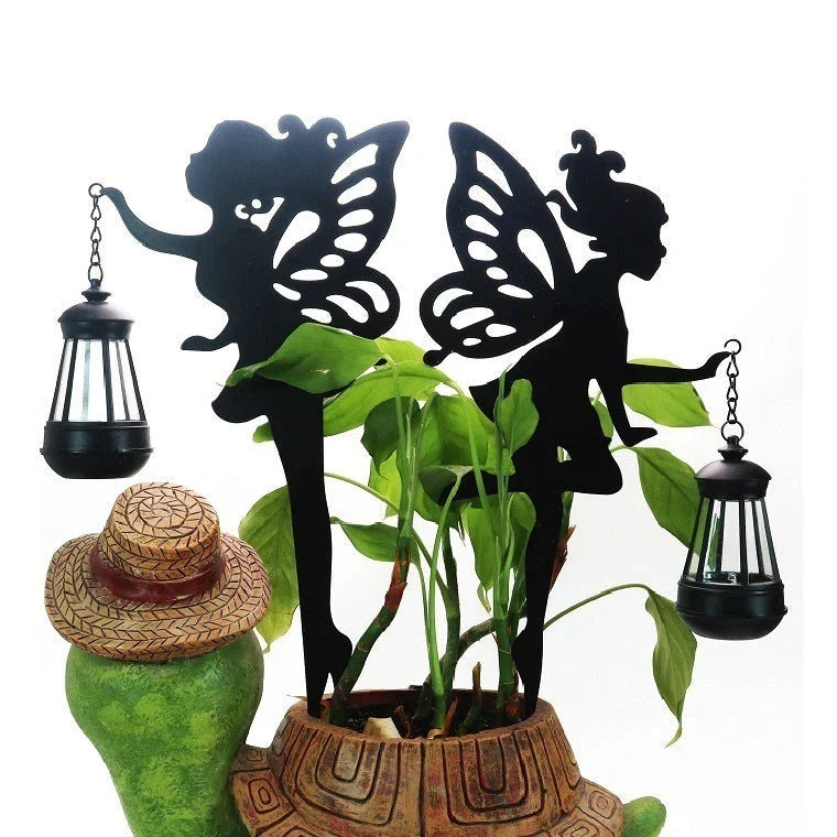Solar-powered outdoor garden light with wrought-iron fairy lantern design, perfect for illuminating pathways, patios, and landscapes.
